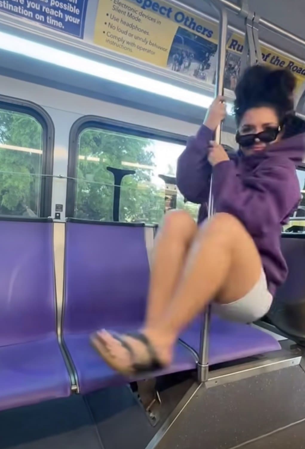 Sexy Mexican girl at public transportation on the pole