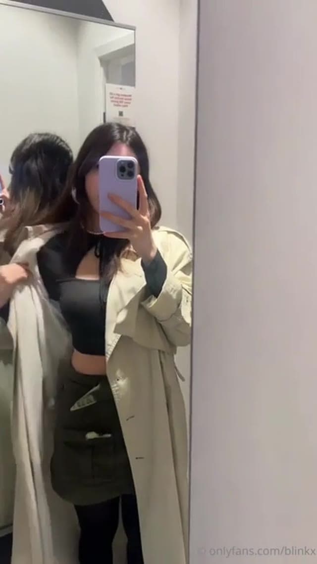 hot slut masturbates in a public dressing room